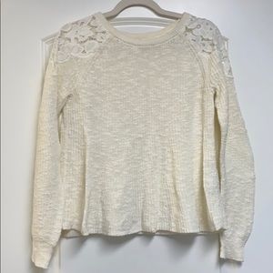 Cream sweater with flower detail on shoulders